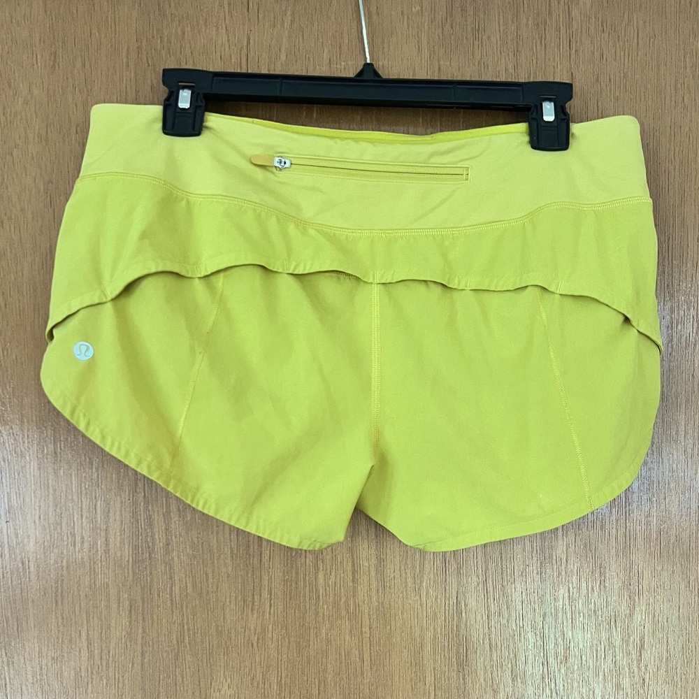 Gently worn Lululemon shorts size 8 small discolored spot on top front